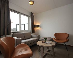 Gezellige zithoek in Landleven 4/5 pers. vakantiehuis, De Koog, Texel met uitzicht op de omgeving.