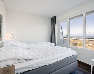 Bedroom in Apartment Juliana 154 Zeezicht, De Koog, Texel with comfortable bed and beautiful sea view.