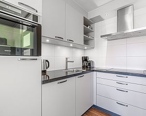 View from Apartment Juliana 154 Zeezicht in De Koog, Texel with vast dunes and the sea on the horizon.