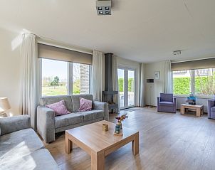 Bright living room overlooking garden in Holiday home Honeysuckle 63, De Koog, Texel.