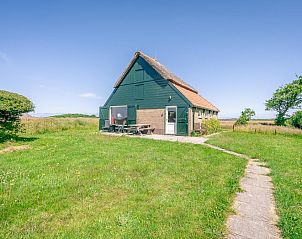 Schapenboet De Boet in De Koog, Texel at sunset. Enjoy a serene vacation home experience on the Wadden Islands.