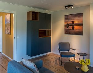Stylish interior of Zilte Bries vacation home, De Koog, Texel, with art on the wall.