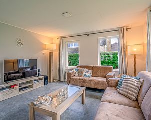 Modern living room with television in Holiday home Honeysuckle 45, De Koog, Texel.
