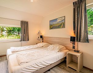 Attic room with two beds in Holiday Home Honeysuckle 45, De Koog, Texel, with skylight.