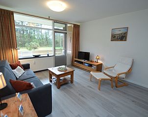 Bright living room of Apartment Kerckeland 20 in De Koog, Texel overlooking the green surroundings.
