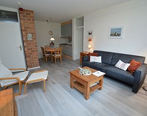 Open living room and kitchen in Apartment Kerckeland 20, De Koog, Texel with cozy atmosphere.