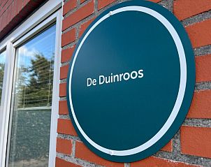 Nameplate of De Duinroos on the facade in De Koog, Texel.