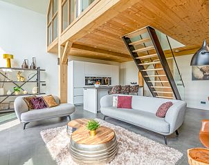 Stylish indoor space in Villa 187 with Hot tub, De Koog, Texel with modern kitchen and comfortable seating area on the Wadden Islands.