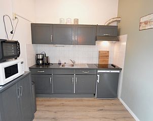 Modern kitchen in Motel Texel - Apartment 314/1S, De Koog, Texel, with microwave and coffee maker.