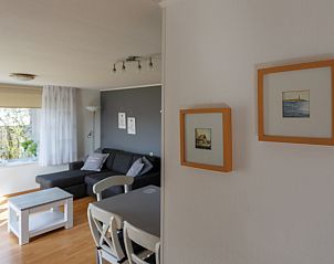 Interior Chalet Bregkoog 207, De Koog, Texel with cozy sitting area.