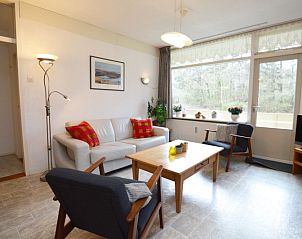 Spacious sitting area of Apartment Kerckeland 16 in De Koog, Texel with modern furnishings and lots of natural light.