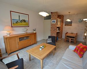 Interior of Apartment Kerckeland 16 in De Koog, Texel with stylish furniture and open kitchen.