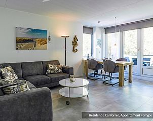 Bright interior of Type 3A accommodation in De Koog, Texel with modern furniture and views of nature.