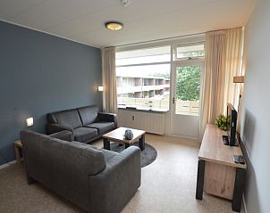 Living room of Apartment Kerckeland 122 in De Koog, Texel with a view of nature.