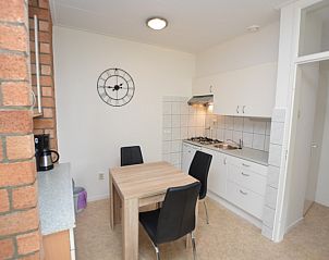 Modern kitchen in Apartment Kerckeland 122, De Koog, Texel with dining table.