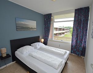Bedroom in Apartment Kerckeland 122, De Koog, Texel with double bed and view.