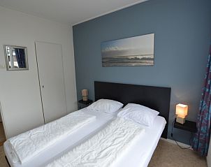 Comfortable bedroom in Apartment Kerckeland 122 on Texel with modern decoration.