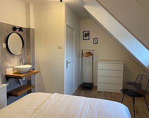 Spacious bedroom with natural light in De Boomleeuwerik vacation home, De Koog, Texel, Wadden Islands.