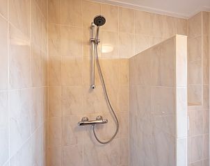 Modern shower in De Boomleeuwerik vacation home, De Koog, Texel, Wadden Islands with luxurious finish.