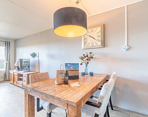 Dining table and atmospheric lighting in Apartment Juliana 046 Island and Sea View, De Koog, Texel, perfect for family dinners.