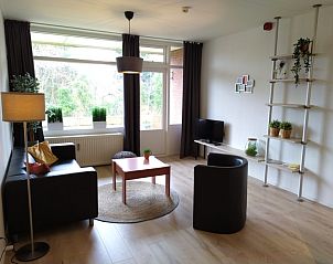 Spacious sitting area in 't Kerckeland - Apartment Kerckeland 82, De Koog, Texel, with modern decor and lots of natural light.