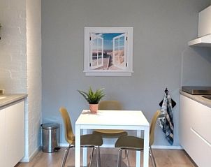 Comfortable dining area in 't Kerckeland - Apartment Kerckeland 82, De Koog, Texel, ideal for a cozy meal on the Wadden Islands.