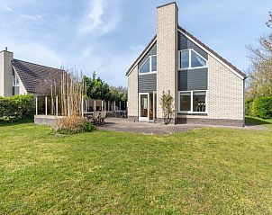 Vacation home Honeysuckle 61 in De Koog, Texel with inviting terrace and green garden.