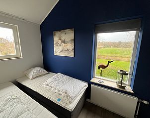 Bedroom with view of nature in De Duinven De Koog Texel