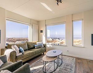 Gemtliche Sitzecke im Appartement Juliana 150 Zeezicht, De Koog Texel, mit Blick auf das Wattenmeer.