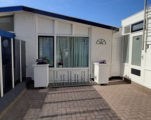 Spacious terrace at Apartment Duinzee Texel, De Koog, ideal for relaxing outside in the sun on the Wadden Islands.
