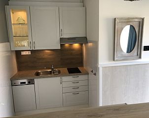 Compact and functional kitchen in Apartment Duinzee Texel, De Koog, equipped with all conveniences for a carefree stay.