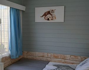 Cozy extra bedroom in Apartment Duinzee Texel, De Koog, with natural light and soothing decor.