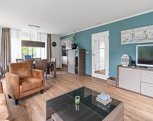 Dining room in Holiday home Honeysuckle 49, De Koog, Texel, with modern interior and lots of natural light.