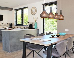 Modern kitchen and dining area in 6 Pers.Landhuis de Luxe Eldorado Texel, vacation home in De Koog.