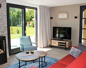 Living room with large windows in 6 Pers.Landhuis de Luxe Eldorado Texel, De Koog.