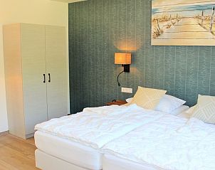 Bedroom with art on the wall in 6 Pers.Landhuis de Luxe Eldorado Texel, De Koog.