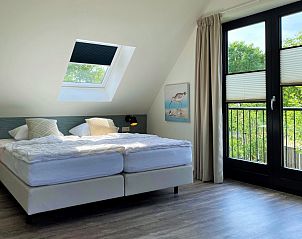 Bedroom with balcony in 6 Pers.Landhuis de Luxe Eldorado Texel, De Koog.