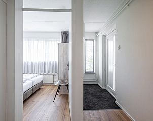 Entrance and bedroom in Two persons apartment large - first floor, De Koog, Texel with natural light.