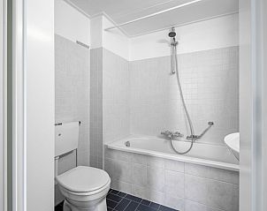 Stylish bathroom with bath in Two persons apartment large - first floor, De Koog, Texel, Wadden Islands.