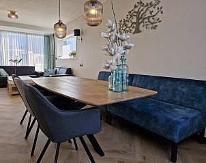 Stylish living room of Holiday home Duinzee Texel in De Koog with comfortable seating.