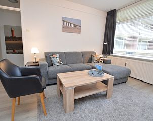 Stylish living room in Apartment Kerckeland 106, De Koog, Texel with large windows and lots of light.