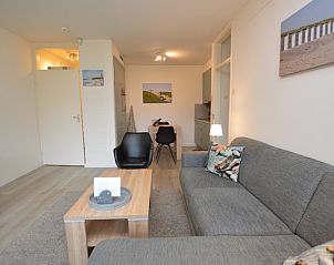 Cozy sitting area in Apartment Kerckeland 106, De Koog, Texel with atmospheric lighting.