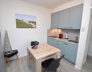 Compact kitchen in Apartment Kerckeland 106, De Koog, Texel with dining area and modern appliances.