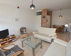 Spacious living room with television in Apartment Kerckeland 80, De Koog, Texel, perfect for cozy evenings.