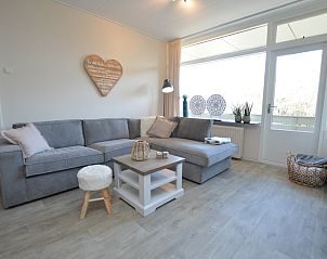 Modern living space in Apartment Kerckeland 78, De Koog Texel, with cozy sofa and decorative elements.