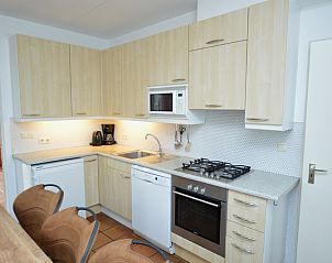 Fully equipped kitchen in Holiday home Stappeland 199, De Koog, Texel, with modern conveniences and spacious layout.