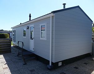 Back side of Chalet Bregkoog 205, vacation home in De Koog Texel with terrace.