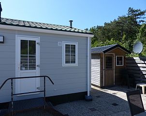 Chalet Bregkoog 205 in De Koog Texel, vacation home with shed and enclosed garden.