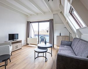 Bright living room in Two persons apartment large - second floor, De Koog, Texel with view of nature.
