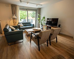 Comfortable sitting area in Landgoed Springtij - Stulpje in De Koog Texel overlooking terrace.